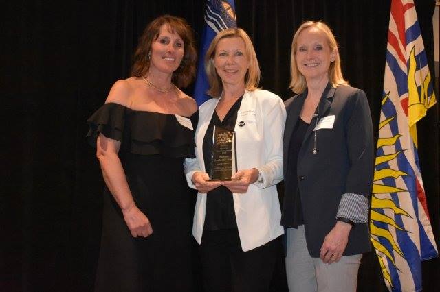 Lorinda Strang and Joanna Journet receiving the West Vancouver Chamber Of Commerce Business Leadership Award